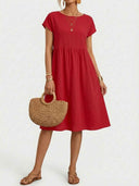 Red short-sleeve mini dress with gathered waist, front view on white background.