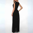 Black wide-leg jumpsuit with shoulder cutouts, angled back view on white background.