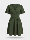 Olive green V-neck mini dress with ruched waist and flutter sleeves, front view.