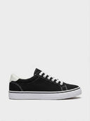 Black low-top canvas trainers with white laces, white rubber sole and contrast topstitching, angled side view.