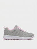 Pink gel-cushioned trainers with grey mesh upper, pink lining and lace accents, cushioned white sole, side view.