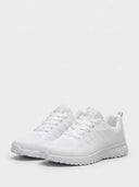 White mesh lace-up trainers with chevron-panel upper and grid-textured sole, angled front view on white background.