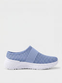Light blue slip-on knit trainer with sparkle upper, elastic strap, and white outsole — side view on white background.