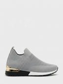 Grey slip-on knit trainer with gold heel accent, breathable knit upper, and black non-slip sole, side view.