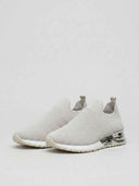 Grey slip-on arch support trainer with chrome heel detail and textured knit upper, angled view.