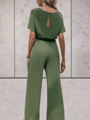 Olive green short sleeve jumpsuit with adjustable cinch belt and keyhole back, shown from the back.