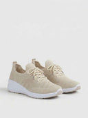 Beige breathable knit walking trainers with white cupsole, three-quarter angled view on white background.