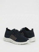 Navy mesh orthopaedic trainers with white cushioned sole and tonal stripes, angled product view on white background.
