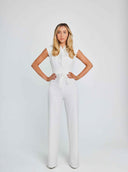 White sleeveless jumpsuit with tied waist and wide legs, front view on white background.