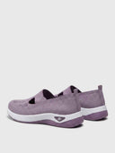 Pair of lilac knit slip-on trainers with white midsoles and purple patterned outsoles, angled rear view.