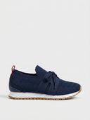 Navy mesh trainers with knit upper, white midsole, and gum rubber outsole, side view on white background.