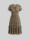 Brown and teal paisley mini dress with V-neck, short sleeves, and tiered ruffles, front view.