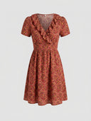 Red paisley mini dress with ruffled V-neck and short sleeves, front view on a white background.