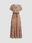 Beige floral print mini dress with V-neck, short sleeves, and brown belt, front view.
