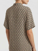 Tan dress with black abstract pattern, short sleeves, back view.