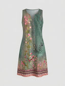 Green sleeveless midi dress with pink floral print, V-neck, and button placket, front view.