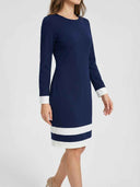 Navy blue mini dress with white cuffs and two white stripes on the hem, front angled view.