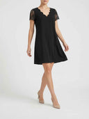 Black midi dress with scalloped V-neck and lace sleeves, front view.